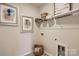 Bright laundry room features wire shelving, wall decor, and ample space at 103 White Apple Way, Statesville, NC 28625