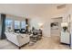 Cozy living room featuring a comfortable sofa, stylish decor, and ample natural light at 103 White Apple Way, Statesville, NC 28625