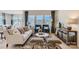 Bright living room with large windows, stylish seating, and contemporary decor at 103 White Apple Way, Statesville, NC 28625