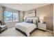 Comfortable main bedroom boasts a large window, soft colors, and stylish furnishings at 103 White Apple Way, Statesville, NC 28625