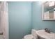 Bathroom featuring a toilet, sink and shower with blue painted walls at 1059 16Th Nw Ave, Hickory, NC 28601