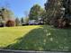 Charming single-Gathering home with a spacious, well-manicured front lawn and mature trees at 1059 16Th Nw Ave, Hickory, NC 28601