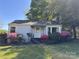 Inviting single-story home with a well-kept lawn, accented by colorful blooming azaleas at 1059 16Th Nw Ave, Hickory, NC 28601