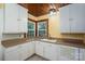 Functional kitchen with white cabinets, a corner sink, and a window offering natural light at 1059 16Th Nw Ave, Hickory, NC 28601