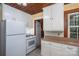 Kitchen including ample storage with white cabinets, appliances, and space-saving design at 1059 16Th Nw Ave, Hickory, NC 28601