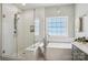 Luxurious bathroom with glass shower, soaking tub, and pendant lighting above for a spa-like feel at 10716 Persimmon Creek Dr, Mint Hill, NC 28227