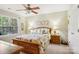 Bright bedroom featuring a ceiling fan, and a window with natural light at 10716 Persimmon Creek Dr, Mint Hill, NC 28227