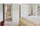 Bright and airy bedroom showcasing a doorway to another room and a closet at 10716 Persimmon Creek Dr, Mint Hill, NC 28227