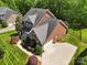 Beautiful brick home with a well-manicured lawn, mature trees, and ample parking space in a lovely neighborhood at 10716 Persimmon Creek Dr, Mint Hill, NC 28227
