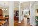 Open hallway with access to the dining room and a view of the living room at 10716 Persimmon Creek Dr, Mint Hill, NC 28227