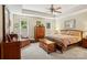 Spacious main bedroom with a tray ceiling, neutral color palette, and ample natural light at 10716 Persimmon Creek Dr, Mint Hill, NC 28227