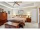 Comfortable main bedroom with neutral tones, ample natural light, and a ceiling fan at 10716 Persimmon Creek Dr, Mint Hill, NC 28227