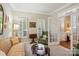 Sitting room with comfortable furniture, shuttered windows, and stylish decor at 10716 Persimmon Creek Dr, Mint Hill, NC 28227