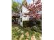 The home features a backyard with a mix of green and red foliage and a two-story deck at 119 N Laurel Ave # 1, Charlotte, NC 28207