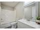 This bathroom features a shower-tub combo, white vanity, and neutral walls at 125 Rocky Pt, Cleveland, NC 27013