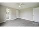 This bedroom has neutral walls, modern gray flooring, and includes bathroom access at 125 Rocky Pt, Cleveland, NC 27013