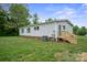 Exterior view features vinyl siding, brick foundation, and stairs to back entry at 125 Rocky Pt, Cleveland, NC 27013