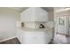 An expansive kitchen boasts white cabinetry and countertops offering ample storage and workspace at 125 Rocky Pt, Cleveland, NC 27013