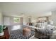 Bright living room featuring wood floors and an open concept design, seamlessly connecting to the kitchen at 125 Rocky Pt, Cleveland, NC 27013