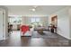Bright living room with an open floor plan that connects to the kitchen and dining area at 125 Rocky Pt, Cleveland, NC 27013