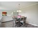 This seating area has a small dining table next to a large living space at 125 Rocky Pt, Cleveland, NC 27013