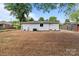 Newly seeded, expansive backyard of a freshly painted white brick home at 1306 Klondale Ave, Kannapolis, NC 28081