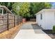 Spacious backyard featuring a mix of gravel and concrete areas offering versatility and low maintenance at 1306 Klondale Ave, Kannapolis, NC 28081