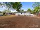 Expansive backyard featuring newly seeded grass and a freshly painted white brick home at 1306 Klondale Ave, Kannapolis, NC 28081