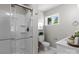 Bright bathroom features a shower with glass door and a modern vanity at 1306 Klondale Ave, Kannapolis, NC 28081