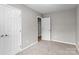 Carpeted bedroom with neutral walls, complete with an adjacent doorway and closet at 1306 Klondale Ave, Kannapolis, NC 28081