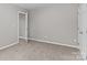 Neutral bedroom featuring carpet floors, light-grey paint, and white trim at 1306 Klondale Ave, Kannapolis, NC 28081