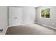 Cozy bedroom features soft carpeting and a view outside at 1306 Klondale Ave, Kannapolis, NC 28081