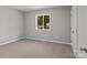 Bedroom featuring neutral paint, carpeting, natural light from window, and closet at 1306 Klondale Ave, Kannapolis, NC 28081