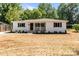 Inviting single-story home featuring a freshly landscaped yard and a welcoming covered front porch at 1306 Klondale Ave, Kannapolis, NC 28081