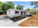 Beautifully landscaped front yard enhances this charming single-story home with a cozy, inviting feel at 1306 Klondale Ave, Kannapolis, NC 28081