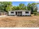 Charming home with fresh landscaping and inviting porch perfect for curb appeal and outdoor enjoyment at 1306 Klondale Ave, Kannapolis, NC 28081