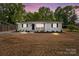 Inviting home featuring manicured landscaping with a fresh, vibrant lawn and mature trees enhancing its charm at 1306 Klondale Ave, Kannapolis, NC 28081