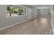 Open living room with lots of natural light, beautiful light gray paint, and light wood-look flooring at 1306 Klondale Ave, Kannapolis, NC 28081