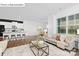 Open-concept living room and kitchen with hardwood floors and modern finishes at 1335 Secrest Commons Dr, Monroe, NC 28112