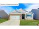 Charming single-Gathering home with a brick and vinyl exterior, well-manicured lawn, and two car garage at 1349 Secrest Commons Dr, Monroe, NC 28112