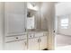 Bathroom featuring white cabinets, a countertop, and a mirror across from a bedroom entrance at 1436 Ardmore Dr # 342, Sherrills Ford, NC 28673