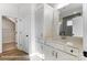 Bathroom featuring white cabinets, countertop, and mirror with access to closet at 1436 Ardmore Dr # 342, Sherrills Ford, NC 28673