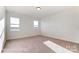 Spacious bedroom with two windows that provide natural light and neutral carpet at 1436 Ardmore Dr # 342, Sherrills Ford, NC 28673