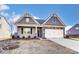 Inviting home featuring stone accents, neutral siding, a two-car garage, and a well-manicured lawn at 1436 Ardmore Dr # 342, Sherrills Ford, NC 28673