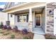 Cozy front porch showing stone pillars and a well-lit entrance with stylish front door and window at 1436 Ardmore Dr # 342, Sherrills Ford, NC 28673