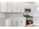 Close-up of kitchen featuring stainless steel appliances, mosaic tile backsplash, and shaker cabinets at 1436 Ardmore Dr # 342, Sherrills Ford, NC 28673