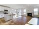 Open-concept living space with a modern kitchen, island, fireplace, and lots of natural light at 1436 Ardmore Dr # 342, Sherrills Ford, NC 28673