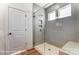 Large tiled shower with glass door, window, and built-in bench at 1436 Ardmore Dr # 342, Sherrills Ford, NC 28673