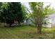 The backyard features green grass, trees, and a shed to store any lawn equipment at 1455 Fieldcrest Cir, Rock Hill, SC 29732