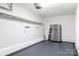 Spacious garage offering versatile storage solutions, including pegboard and shelving at 1455 Fieldcrest Cir, Rock Hill, SC 29732